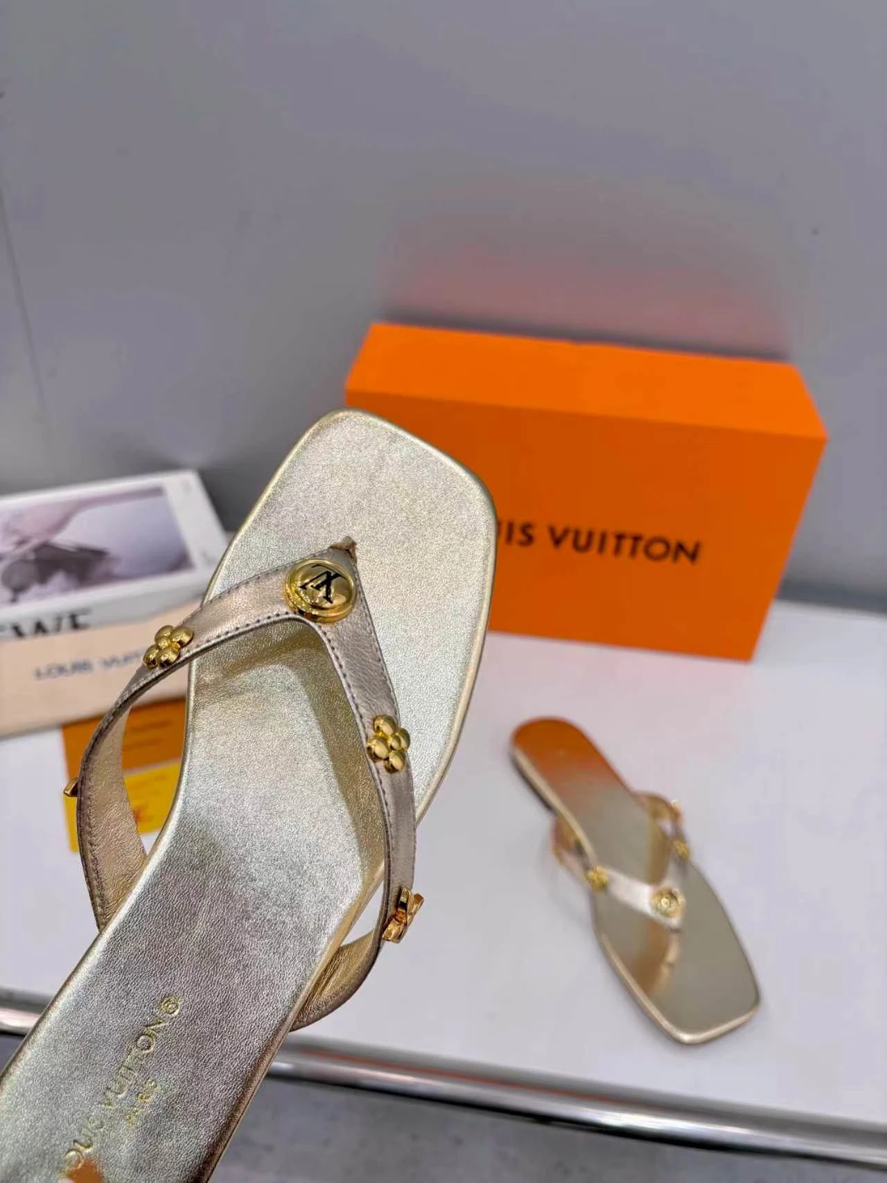 LV rivet flip flops